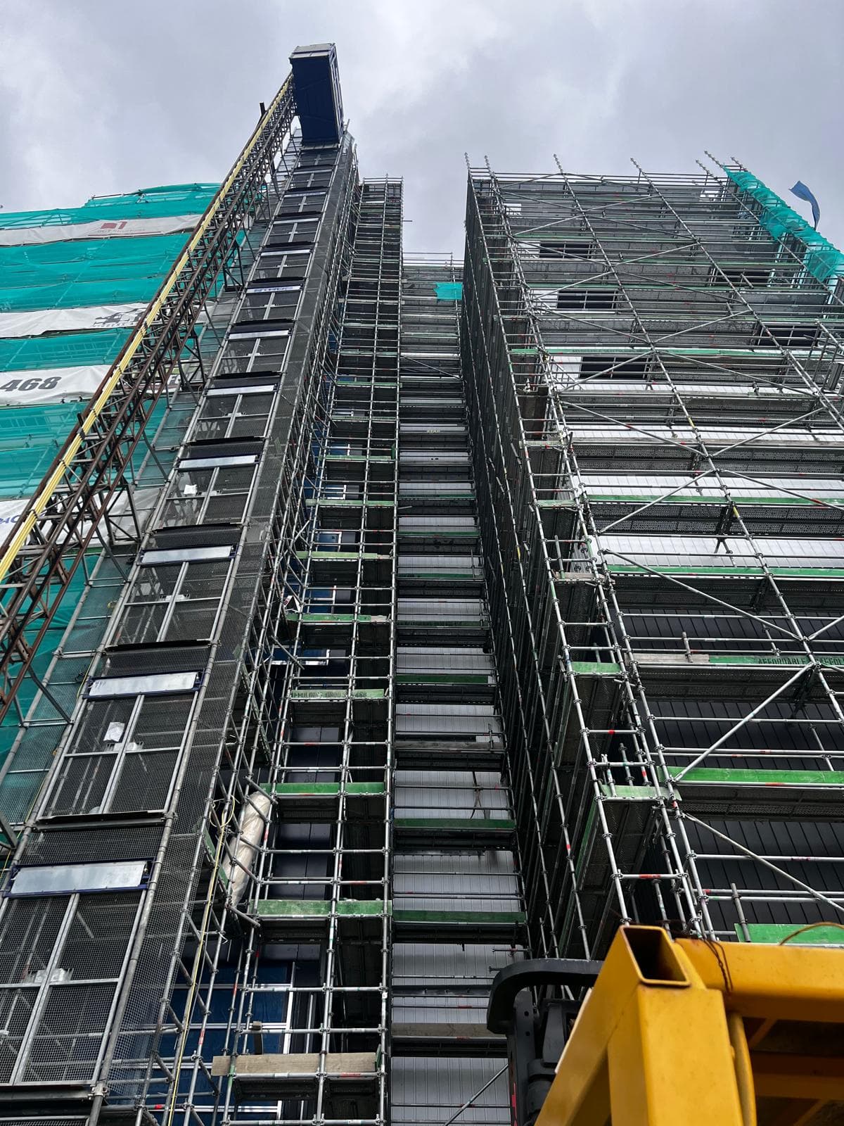 High-rise building facade and service area during mechanical electrical works