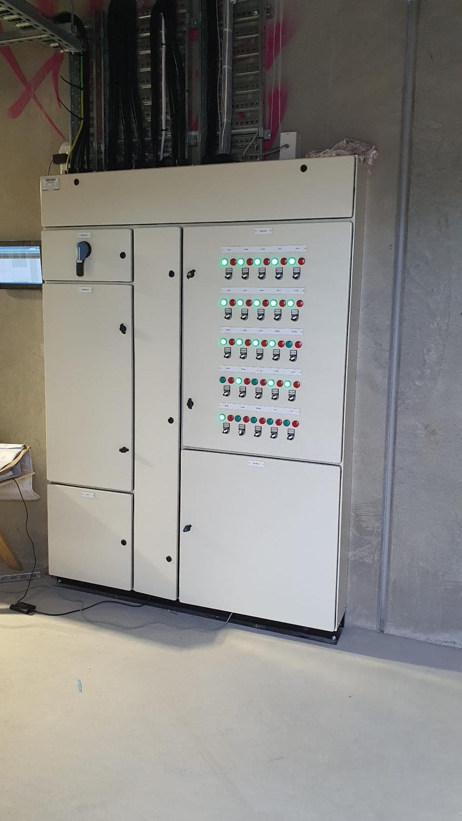 Large main control panel with rows of switches and indicator lights